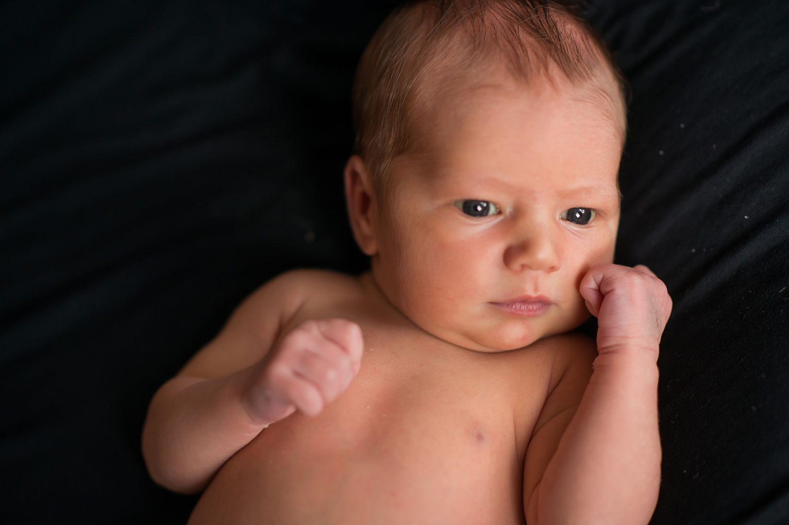 Natural newborn lifestyle session with authentic emotion