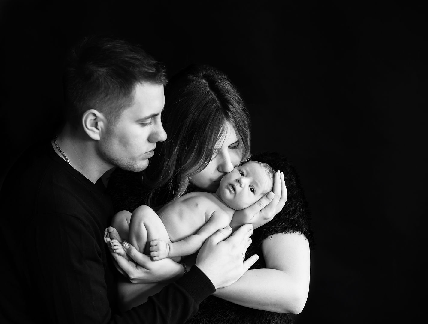 Emotional newborn lifestyle portrait with parent