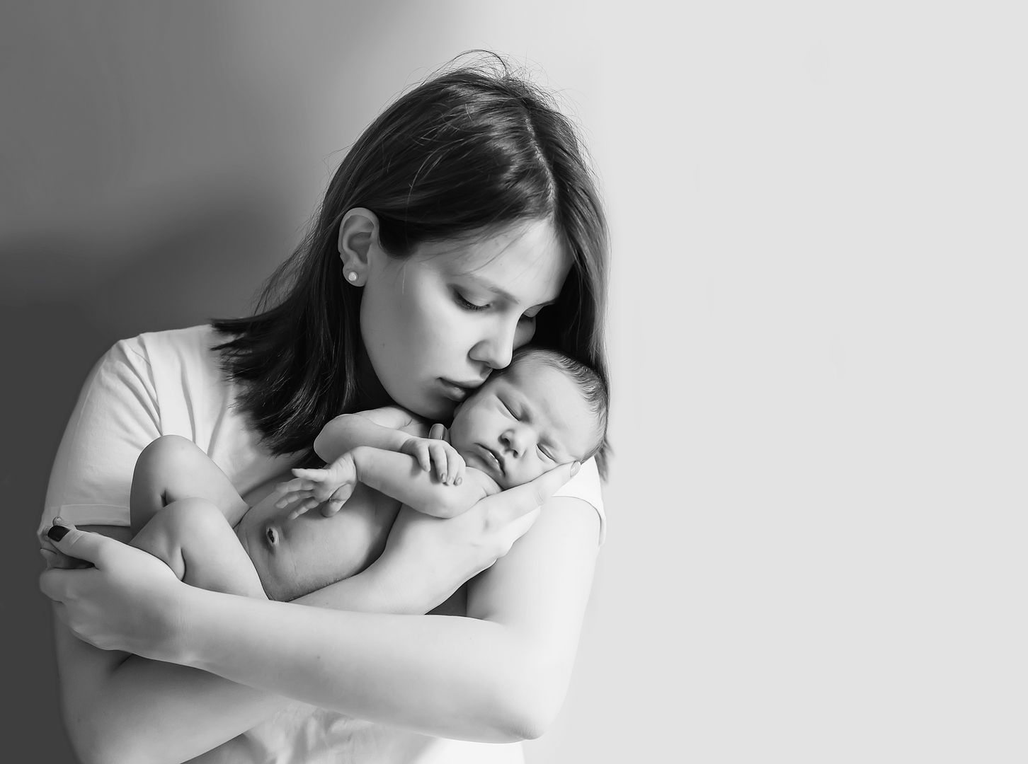 Intimate newborn lifestyle portrait in black and white