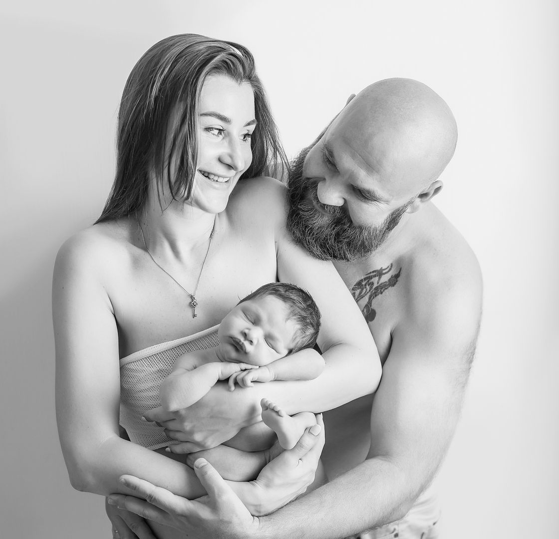 Emotional newborn lifestyle portrait with parent