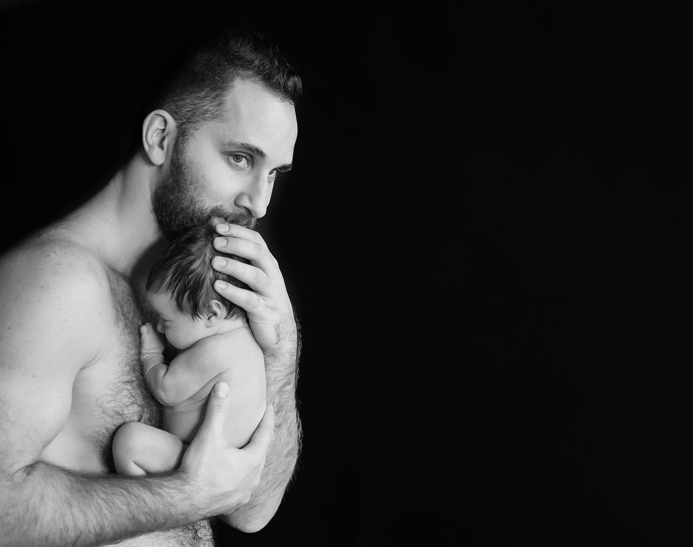 Intimate newborn lifestyle family moment