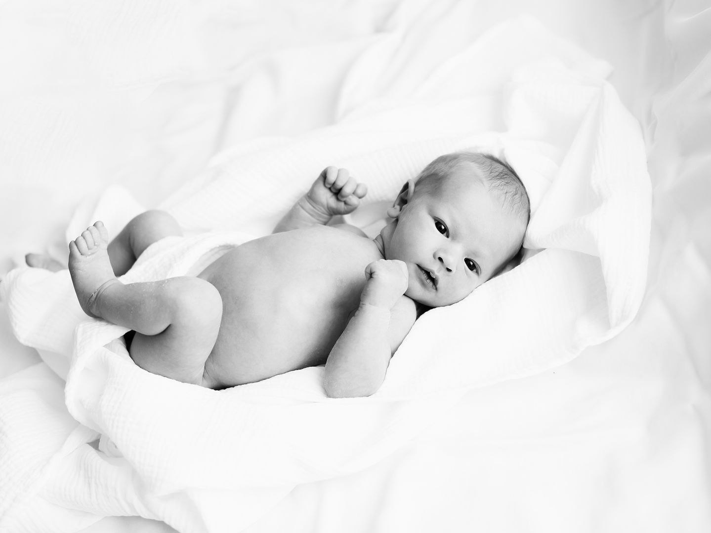 Natural newborn lifestyle portrait with loving parents