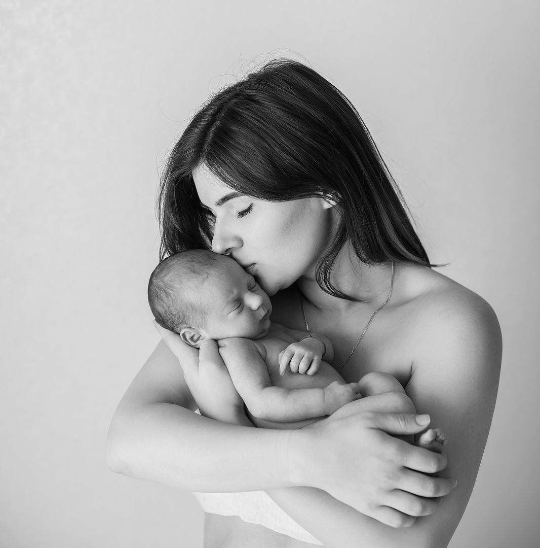 Intimate newborn lifestyle family moment