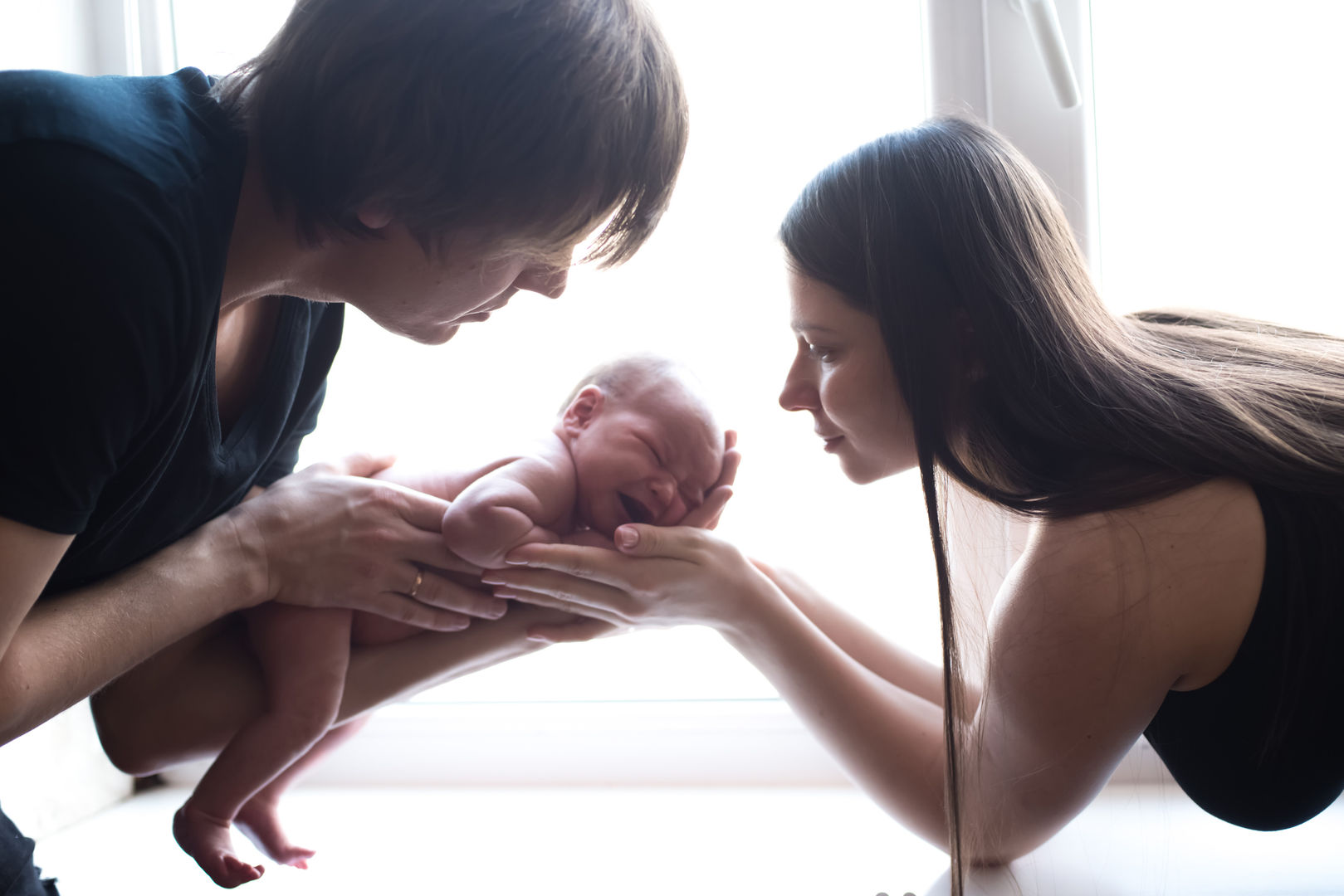 Natural newborn lifestyle portrait with authentic emotion