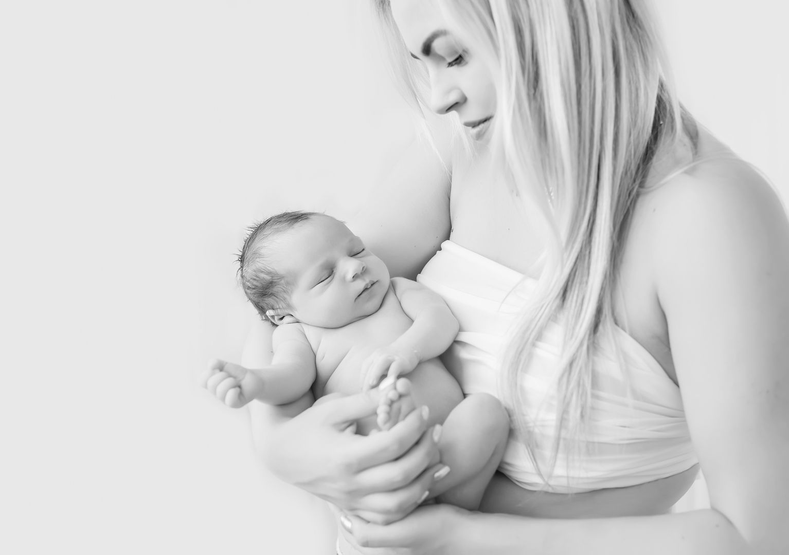 Beautiful newborn lifestyle moment in black and white
