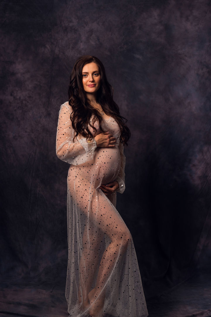 Stunning maternity portrait with dramatic lighting