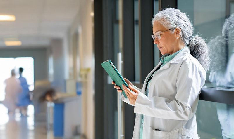 A doctor looking at patient information