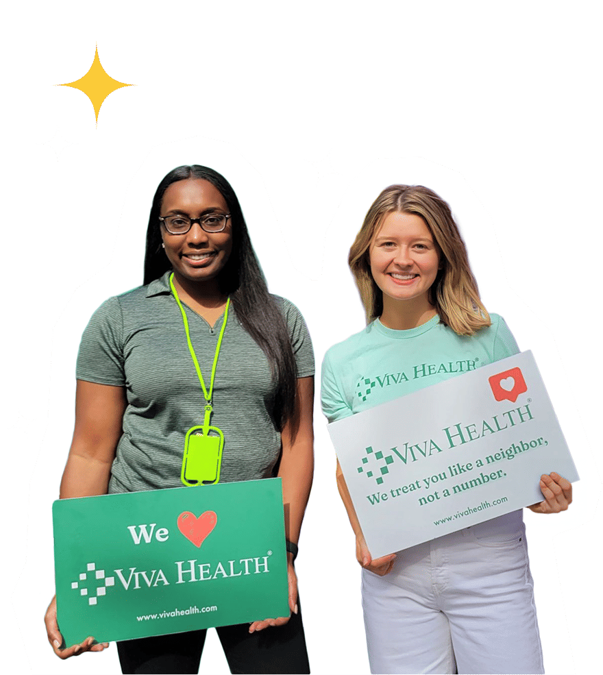 Two smiling women holding Viva Health promotional signs against a black background with stars.