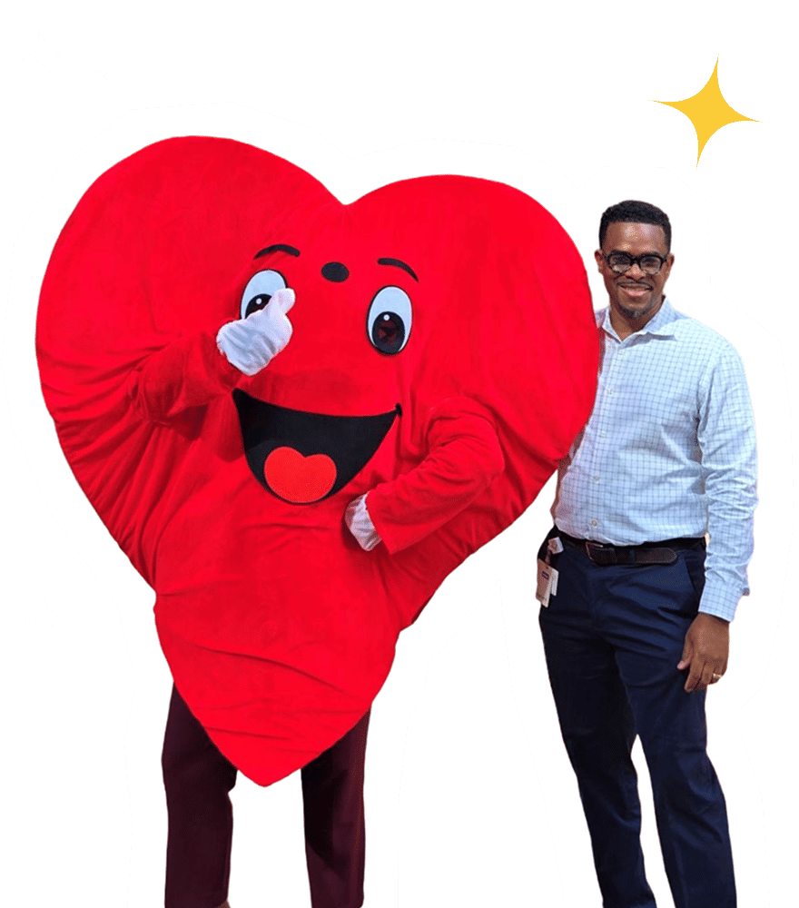 Heart mascot and man side hugging and smiling