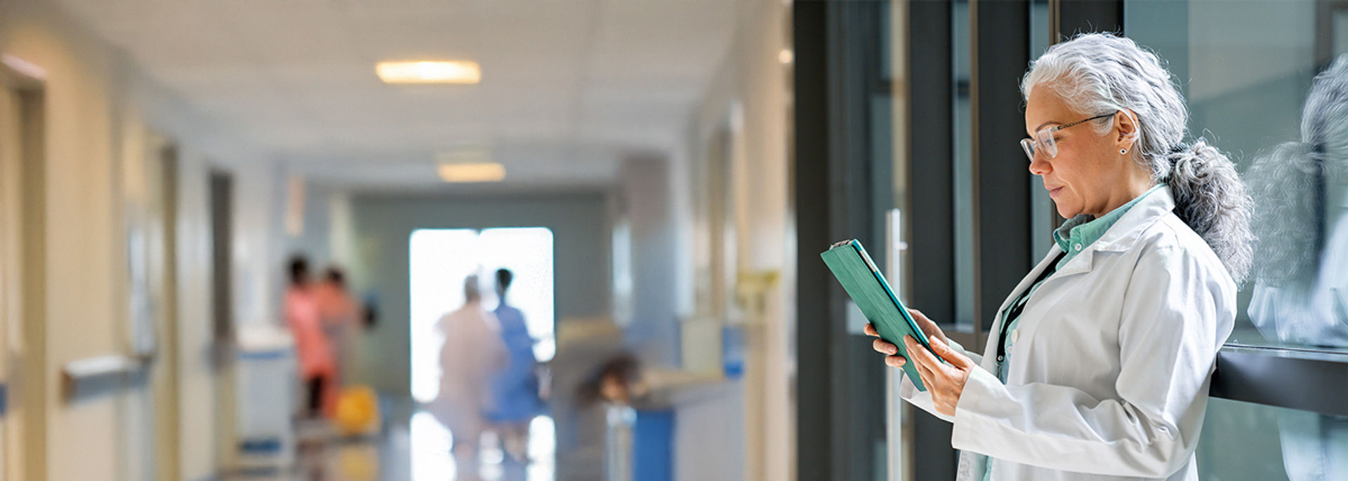 A doctor looking at patient information.