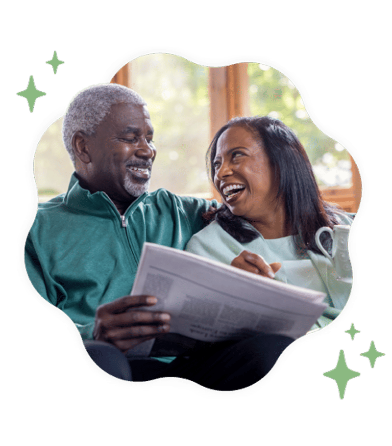 A smiling older couple looking at each other while relaxing with a newspaper and coffee, framed in a wavy shape with green stars.