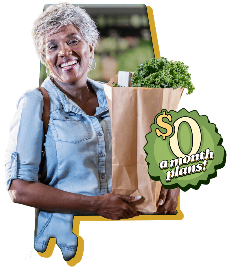 An elderly woman smiling and holding a brown, paper bag with groceries in it.