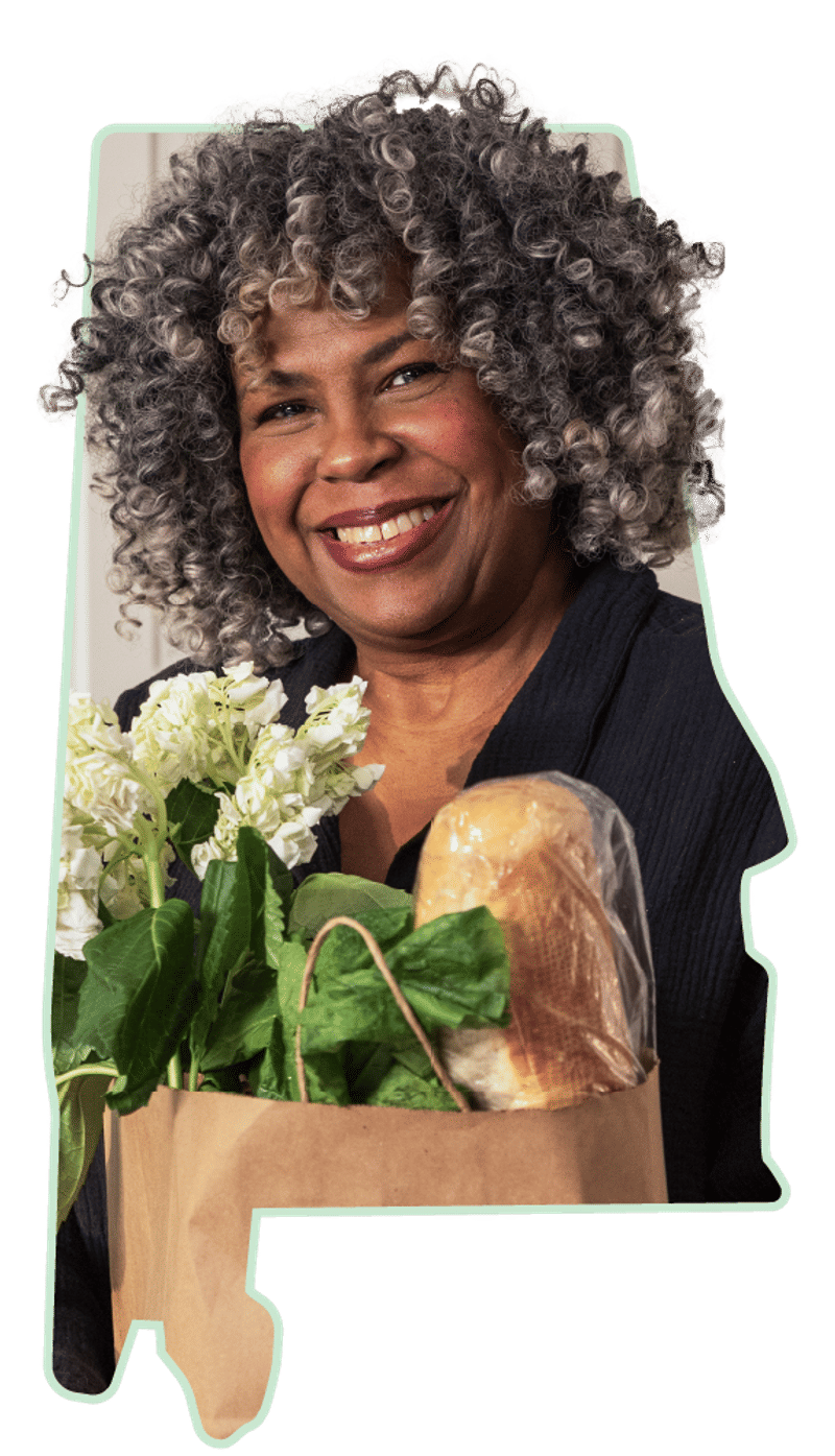 A portrait of a smiling member framed inside the outline of the state of Alabama.