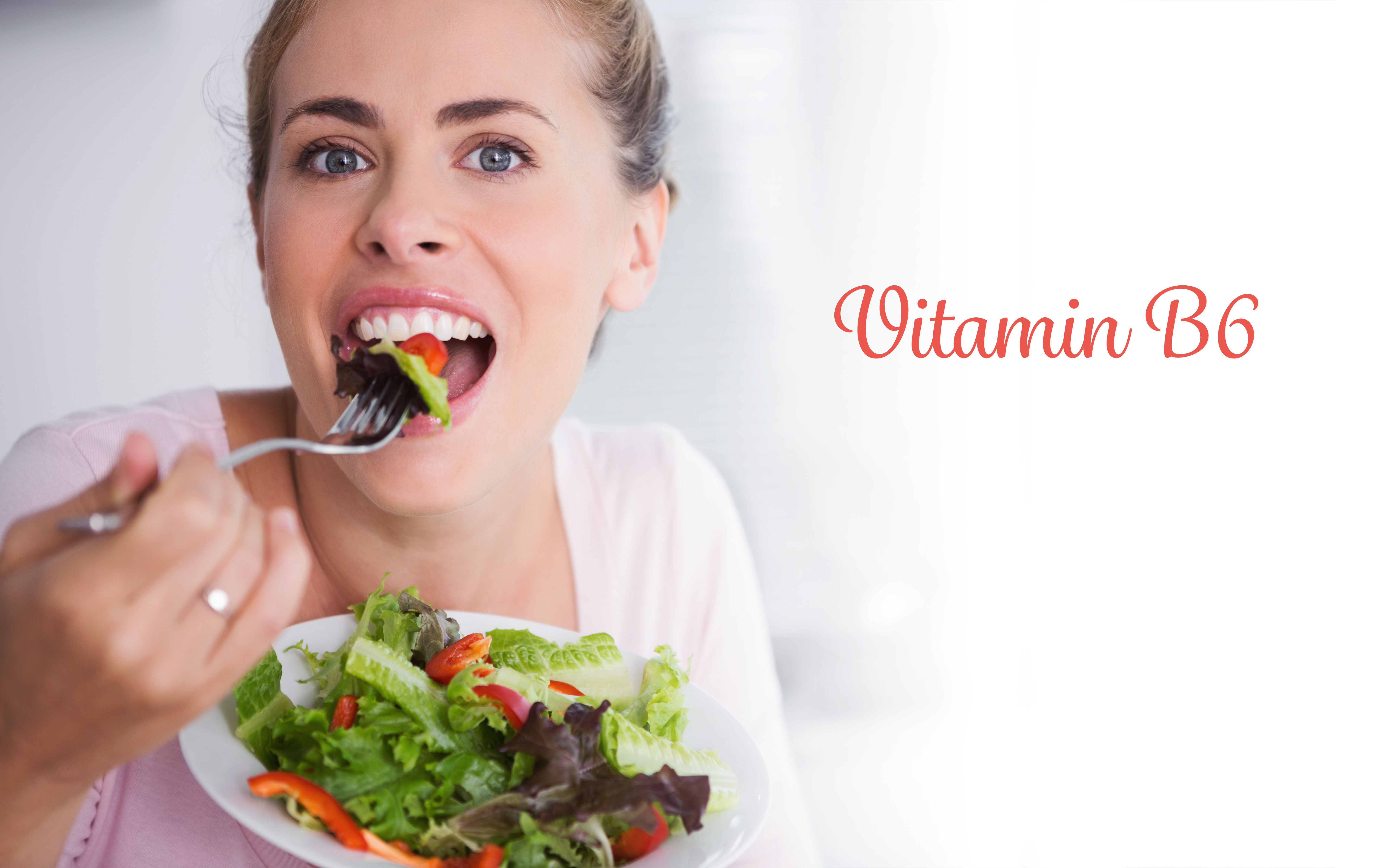 Woman eating a fresh salad representing vitamin B6 food sources — B6 is required for glycogen breakdown and neurotransmitter production, both tied to energy and mood