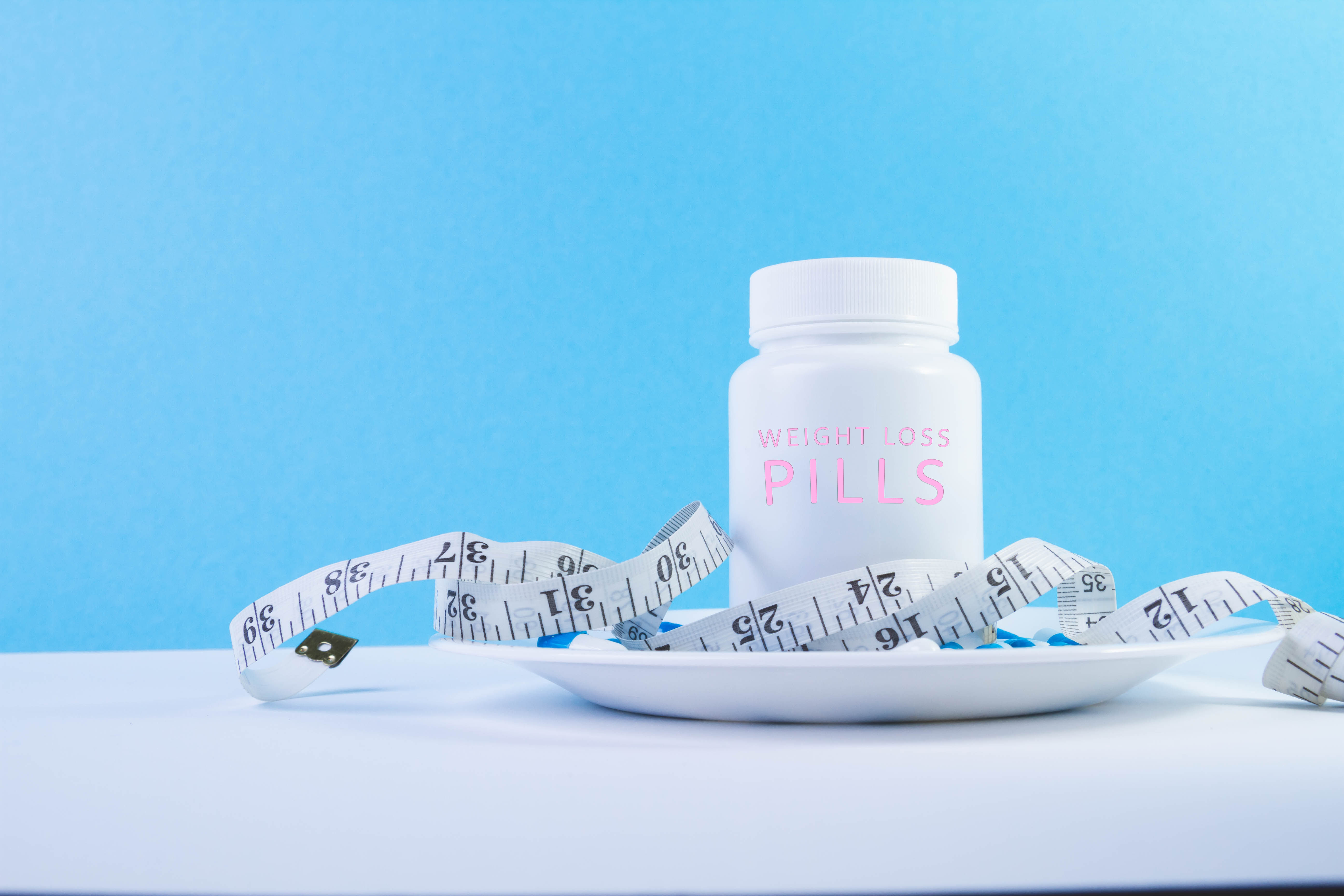 Weight loss medication pills and obesity treatment supplements showing the relationship between GLP-1 drugs like Ozempic and Wegovy and nutrient depletion