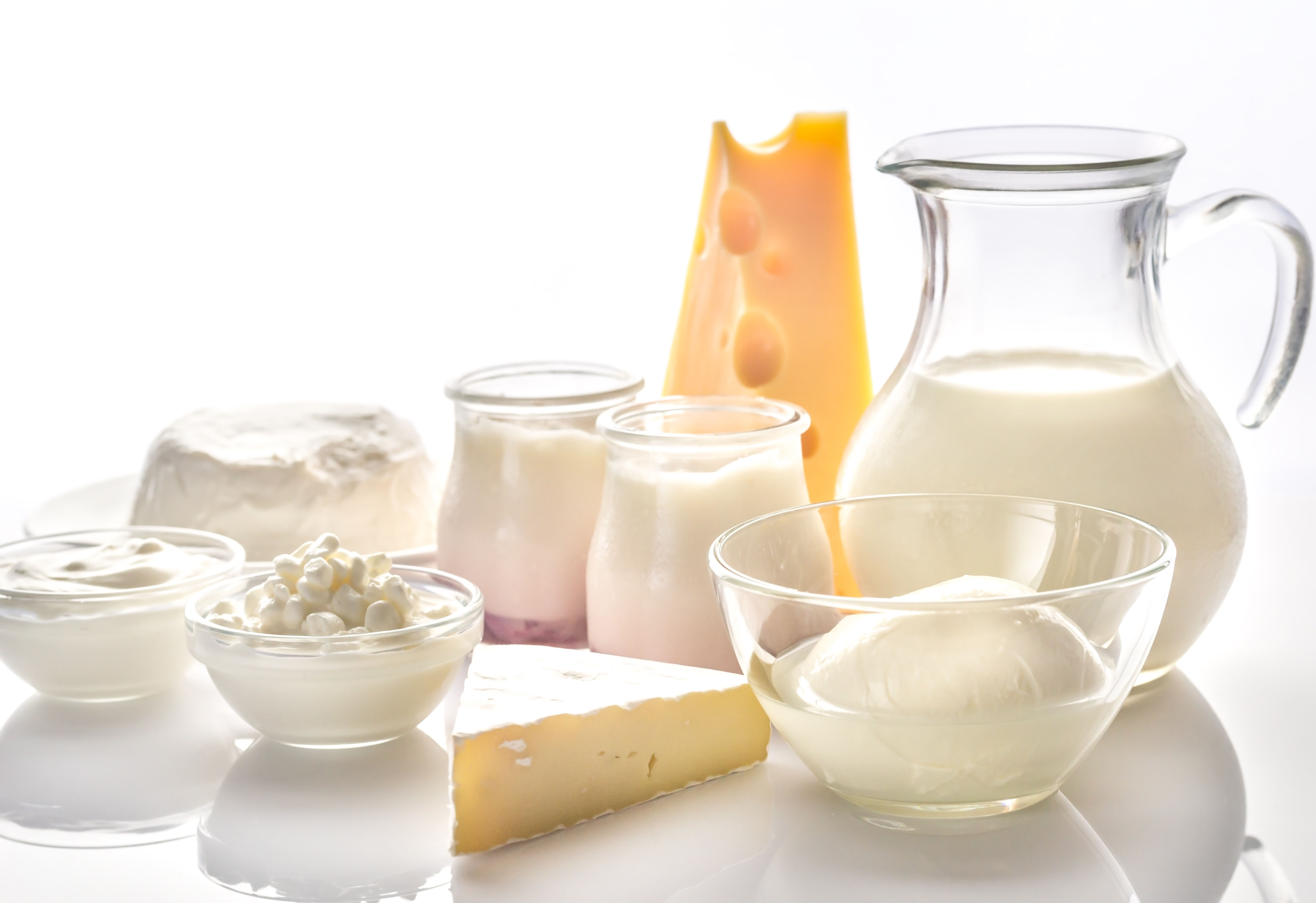Dairy products including milk, cheese, and yogurt representing calcium and protein sources important during the metabolic shift of the 30s decade