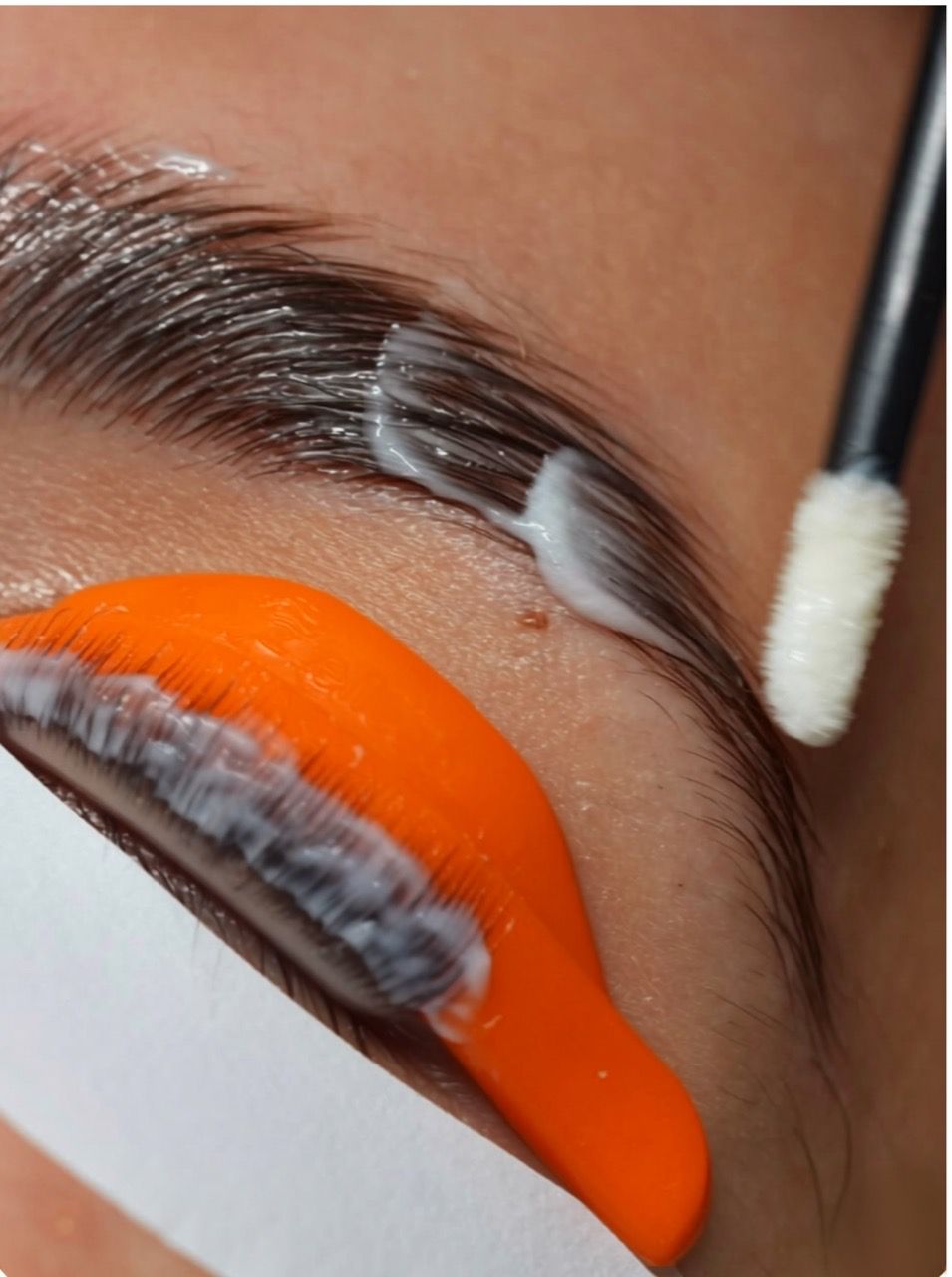 eyebrow-treatment,brow-styling,beauty-service,close-up,facial-treatment,professional-beauty,portrait-format