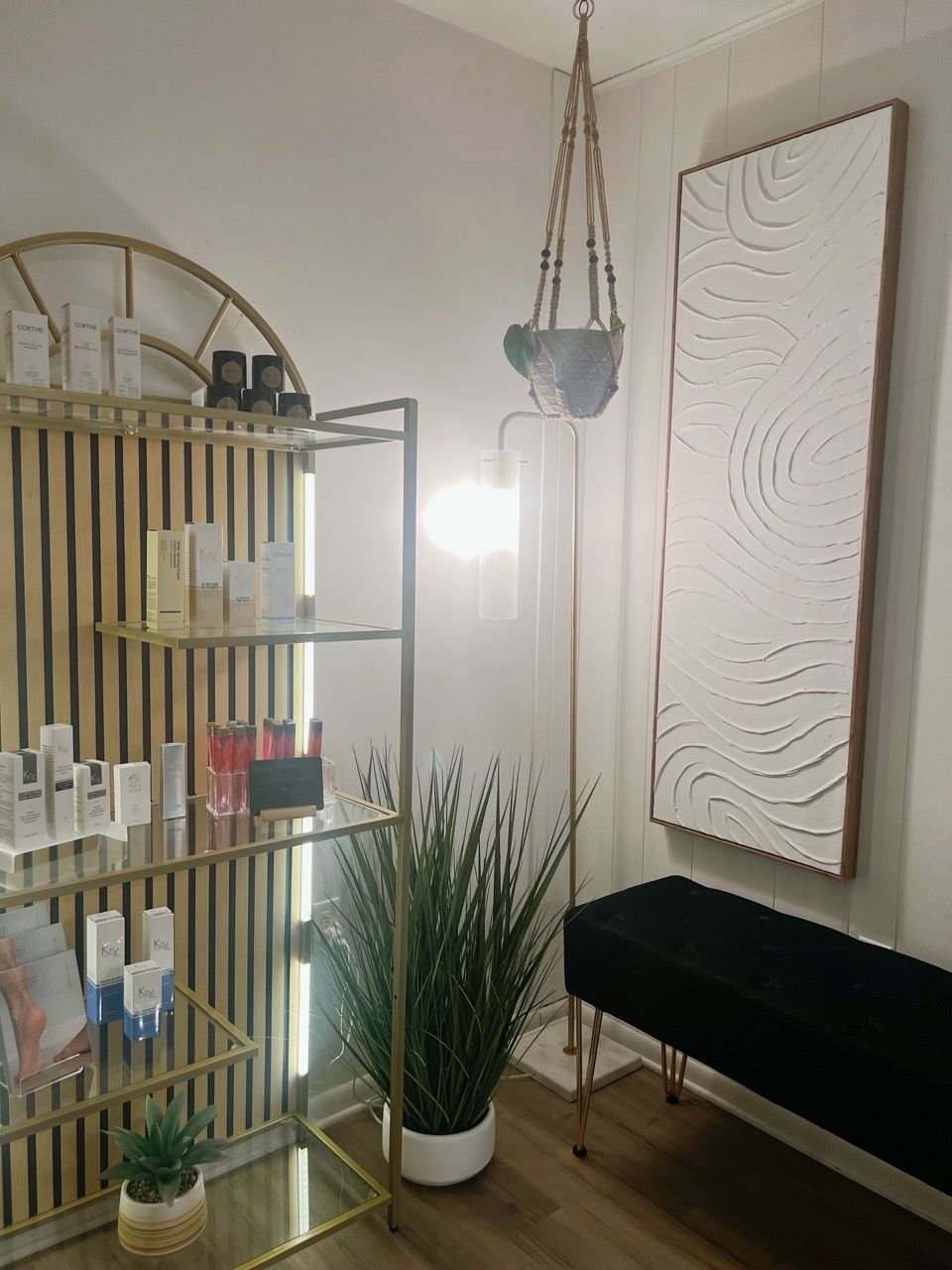 treatment-room,skincare-products,retail-display,spa-interior,wellness,modern-decor,plants,ambient-lighting,professional-setting