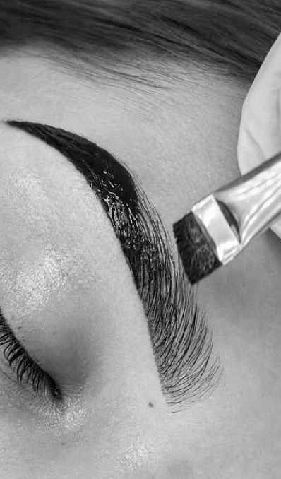  eyebrow-treatment,brow-styling,cosmetic-procedure,beauty-service,close-up,monochrome,detailed,professional  