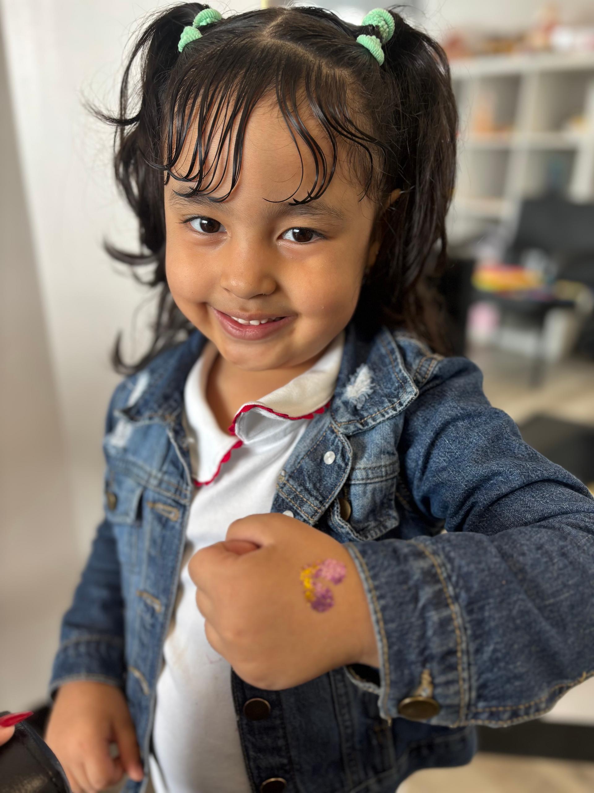 child,smile,face painting,denim jacket,fun