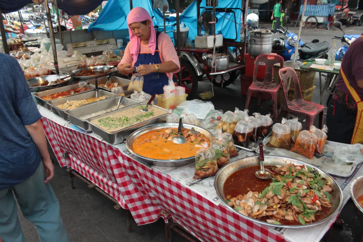 Street food stall in Ayutthaya offering various Thai dishes.