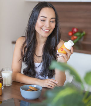 A woman looking at a nutraceutical product.