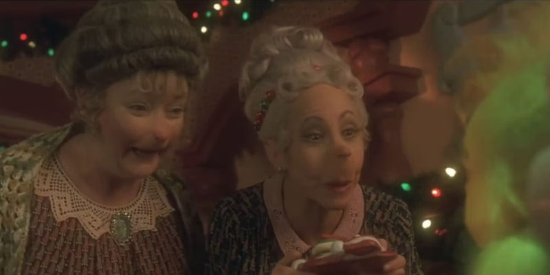 Rose (Rachel Winfree) and Clarnella (Mindy Sterling) Who feeding baby Grinch in How the Grinch Stole Christmas.