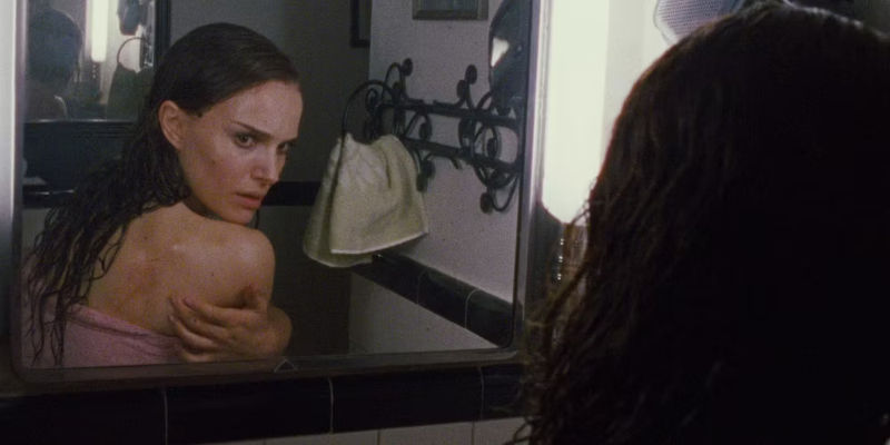 Nina inspects her rash in the mirror in Black Swan