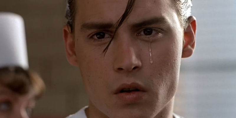Cry-Baby (Johnny Depp) with a tear running down his cheek in Cry-Baby.