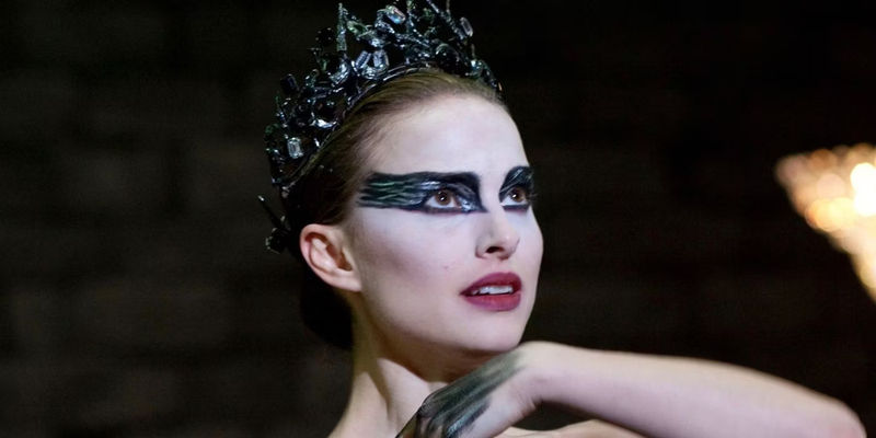 Nina Sayers (Natalie Portman) smiling and looking upwards during her performance in Black Swan