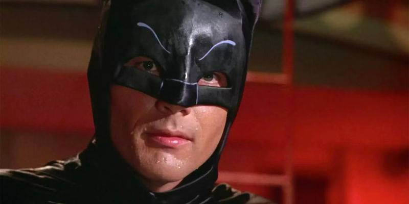 Adam West in the Batman cowl