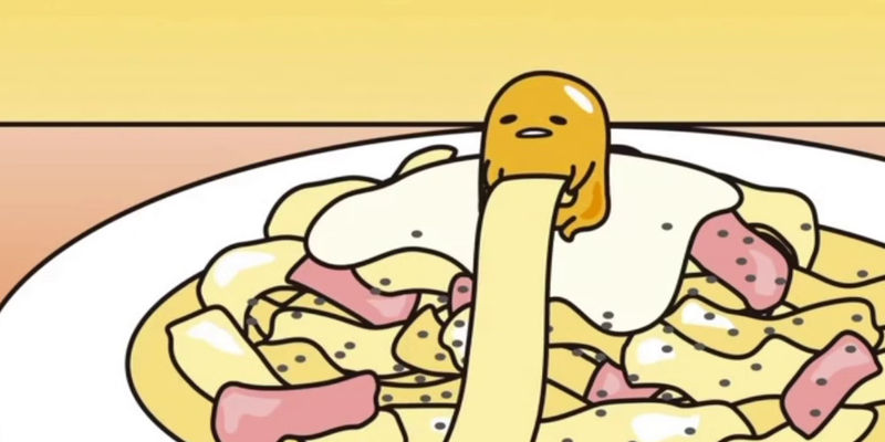 An illustration of the Sanrio character Gudetama on a plate of fettucine