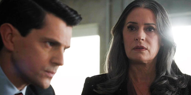 Emily Prentiss gazing off with concern in front of Deputy Director Doug Bailey in Criminal Minds-2