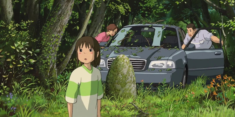 Chihiro looking back while her parents clean off their car in the background at the end of Spirited Away.