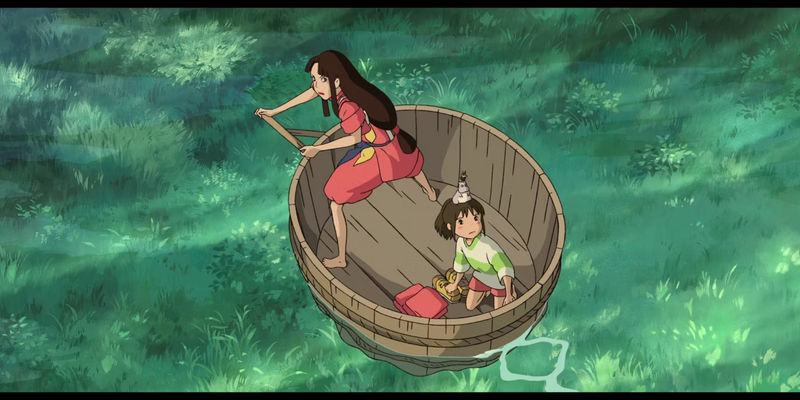 A woman paddles a boat as a girl sits inside with a mouse on her head.