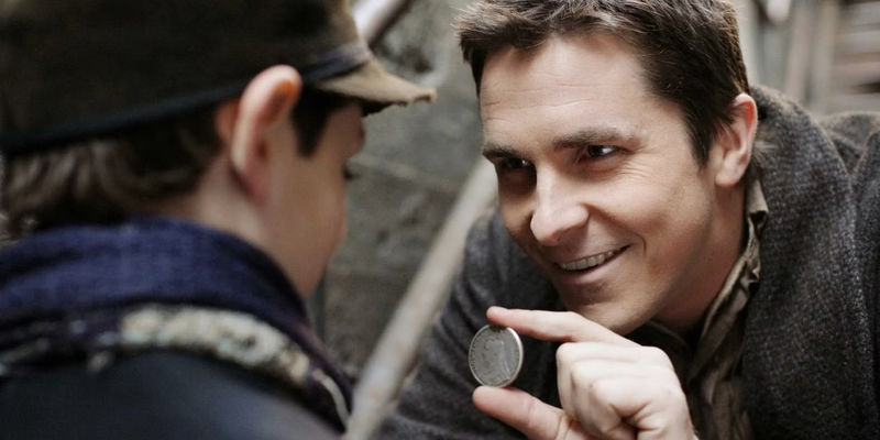 Christian Bale performing a coin trick in The Prestige