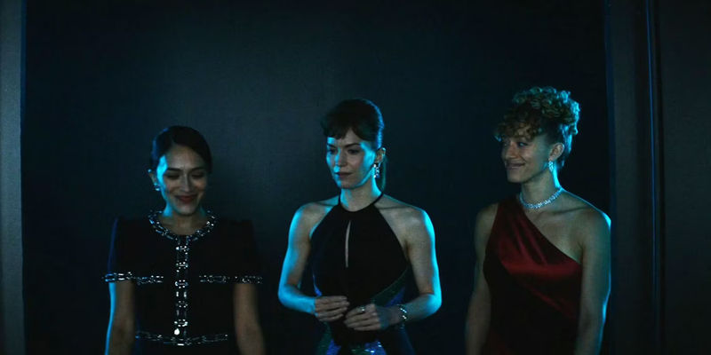 Three women standing in Severance.