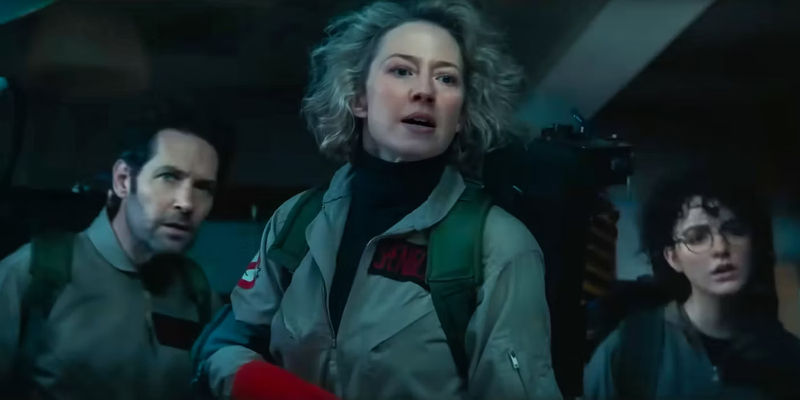 Carrie Coon, Paul Rudd, and Mckenna Grace looking at something in Ghostbusters: Frozen Empire