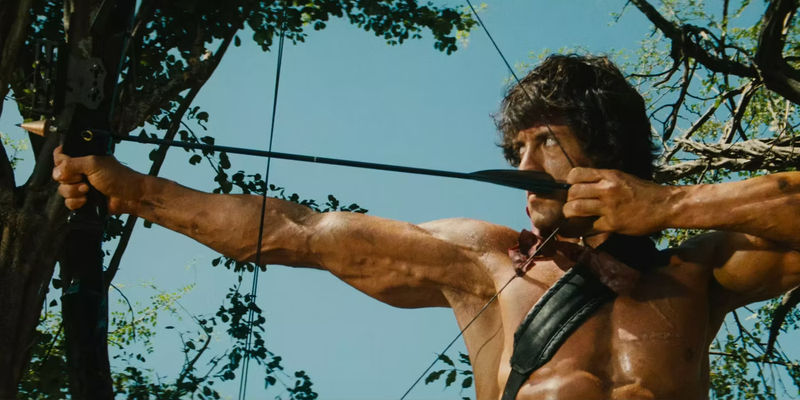 Sylvester Stallone shooting an arrow in Rambo First Blood II