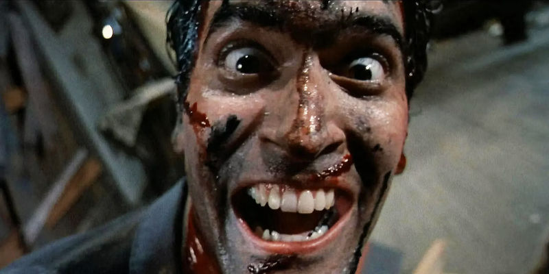 Evil Dead 2 Bruce Campbell as Ash Williams looking crazy.