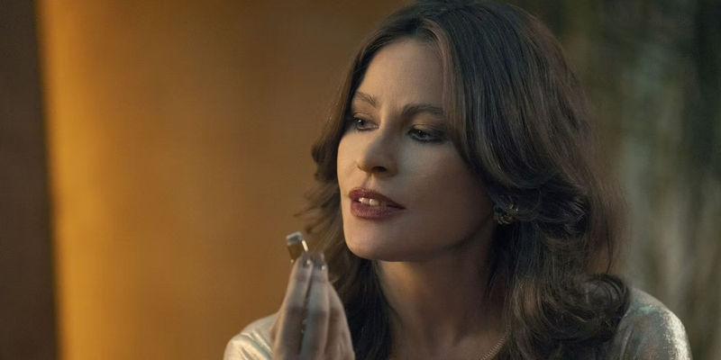 Sofía Vergara as Griselda Blanco in a scene from Griselda holding a small cylinder.