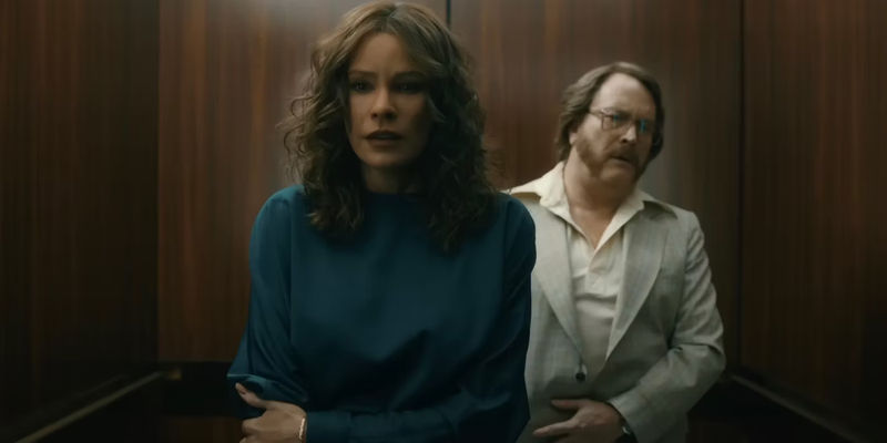 Sofia as Griselda in elevator with Arturo behind her.