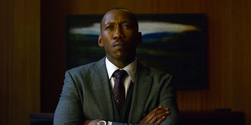 Cornell Stokes/Cottonmouth with his arms crossed in Luke Cage. 