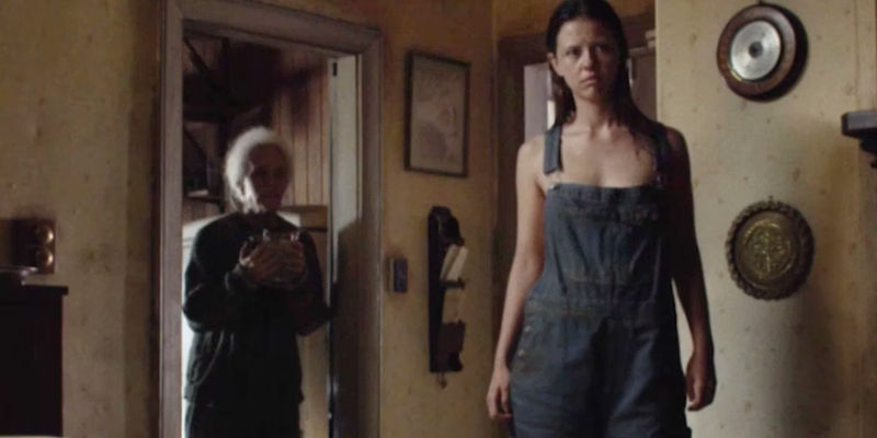 Pearl staring at Maxine in her kitchen in X