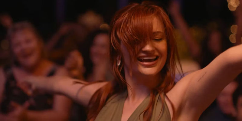 Leah McKendrick dances freely in a club in Scrambled