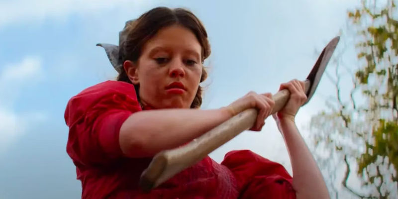 Mia Goth holding an axe in Pearl