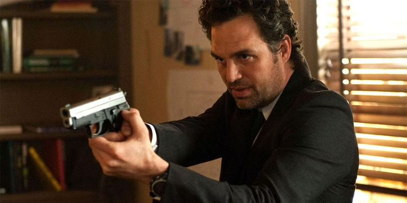 Dylan pointing a gun from Now You See Me 