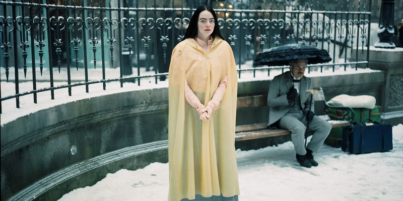 Emma Stone standing in the snow in Poor Things.