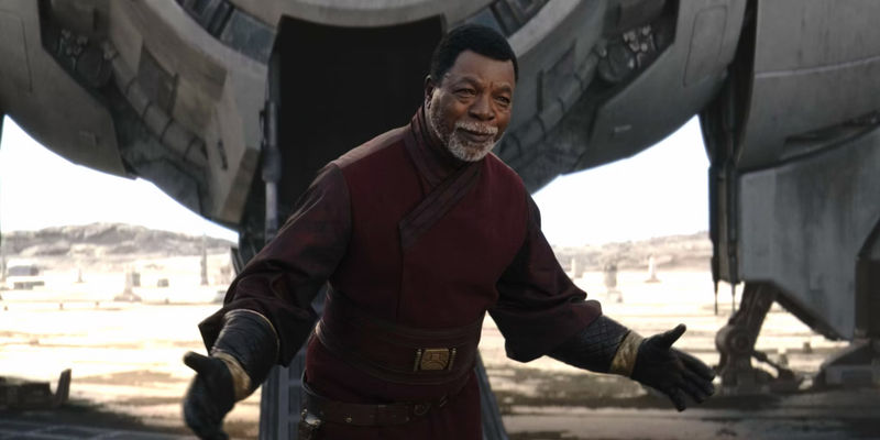 Carl Weathers as Greef Karga bows to the Mandalorians in The Mandalorian season 3 episode 5