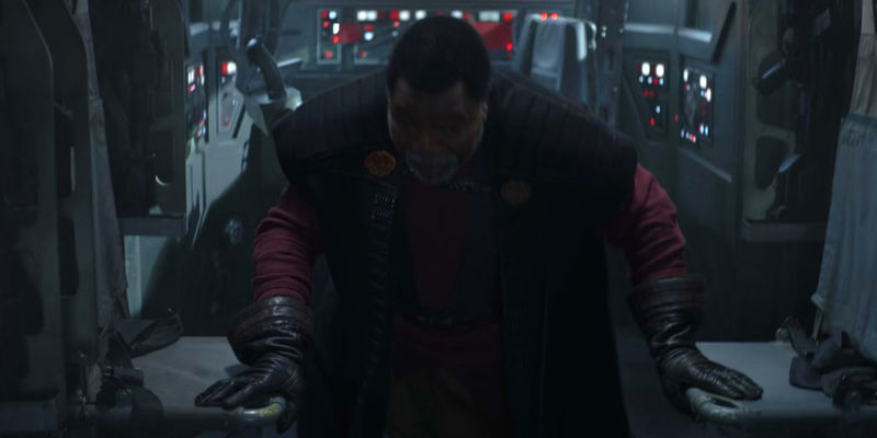 Carl Weathers as Greef Karga recovers after jumping away from an explosion in The Mandalorian season 2 episode 4